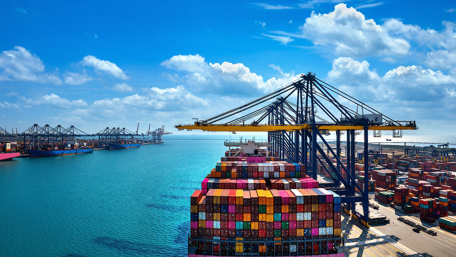 Cargo containers moving through an international port